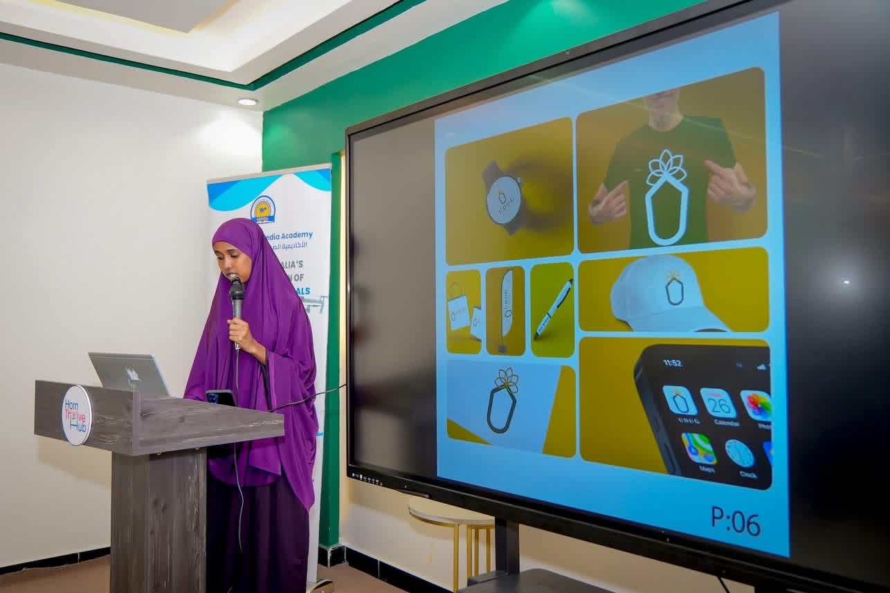 A trainee presenting a brand identity project